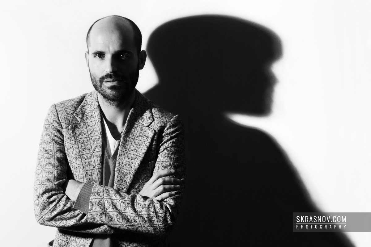 Jose Enrique Ona Selfa, fashion designer. Portrait with shadow © Sasha Krasnov Photography